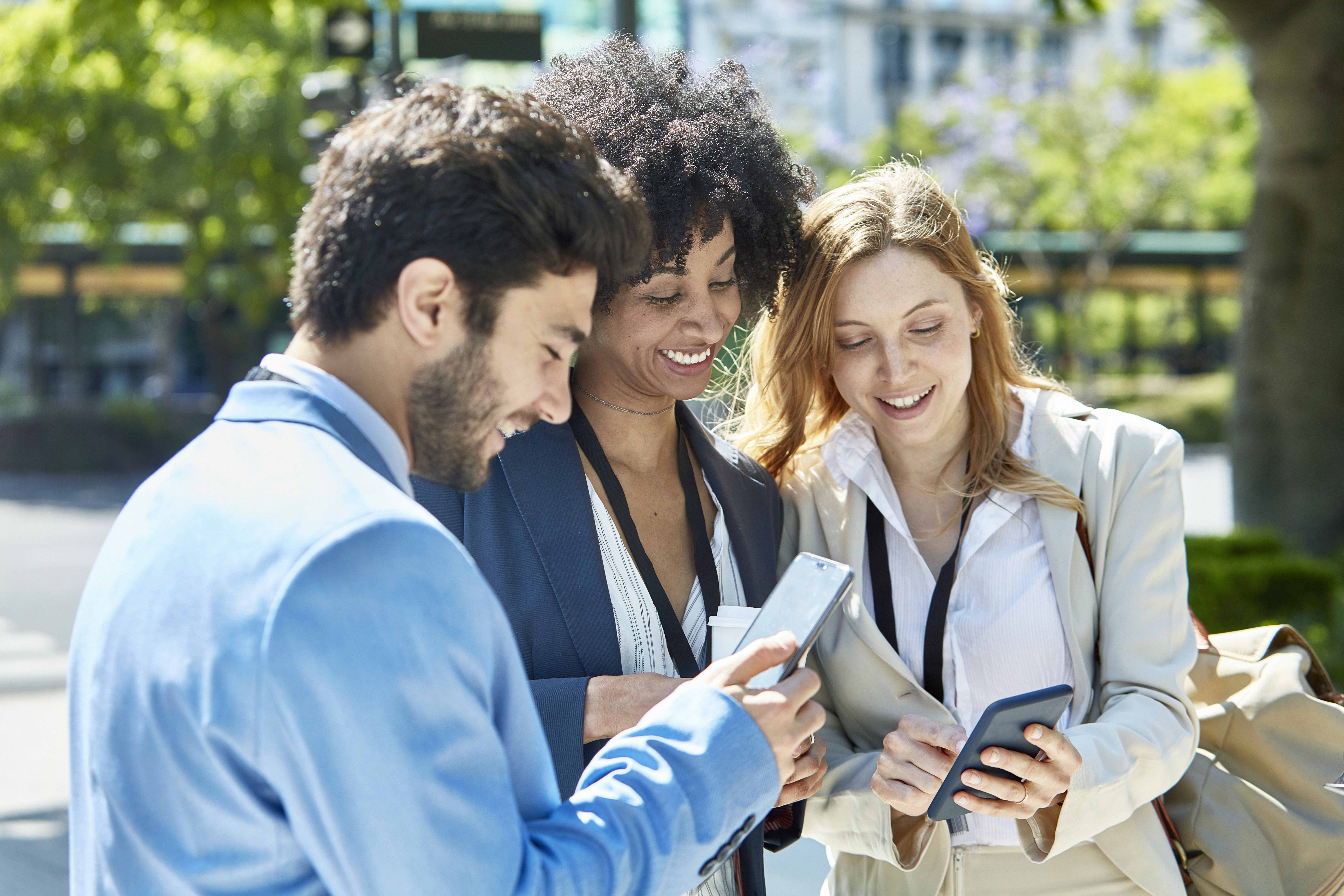 Buenos Aires Businesspeople Checking Smart Phones Outdoors