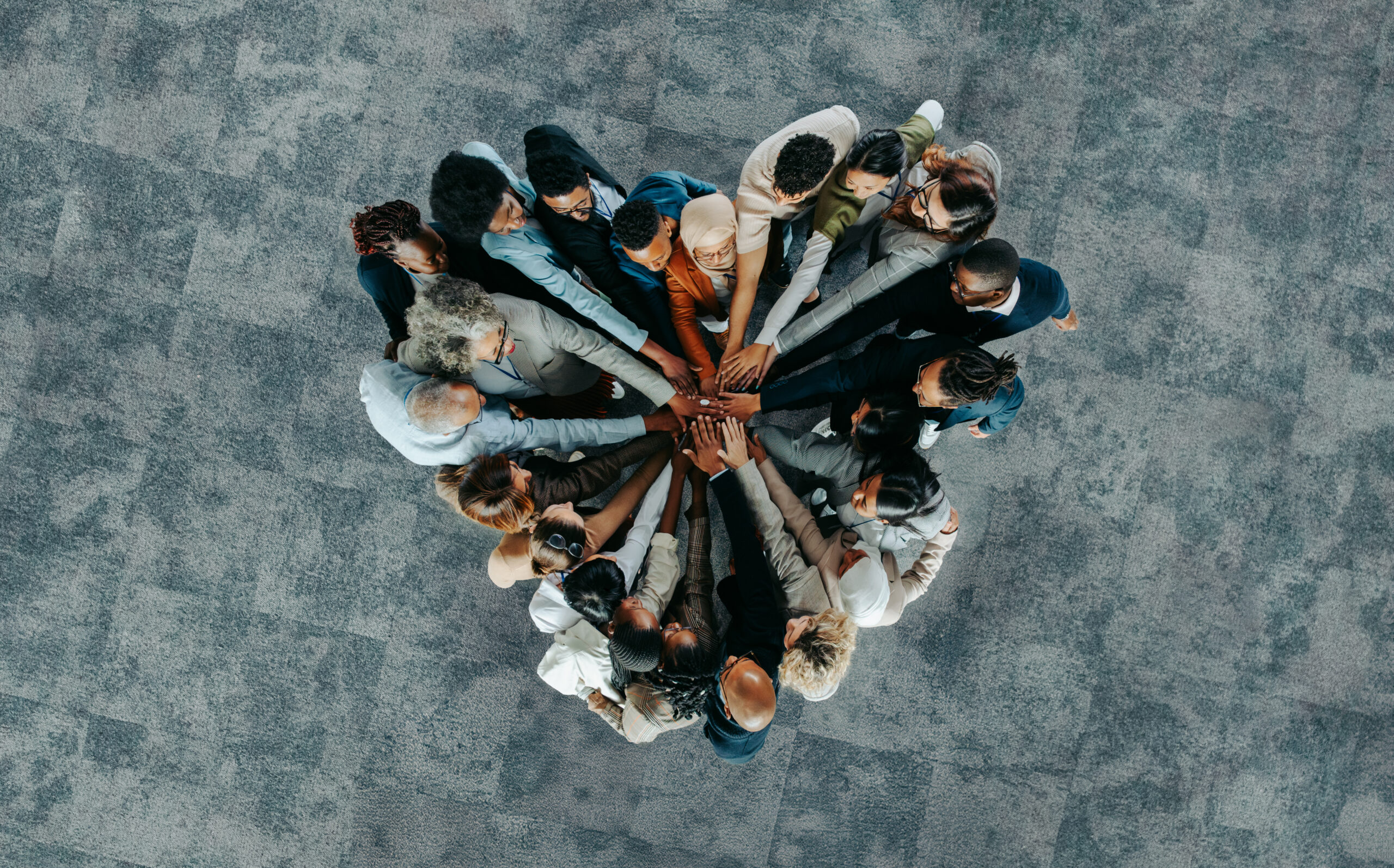 Top view of a a heart shape of people, showing unity and teamwork